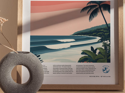 A framed poster depicts a tropical beach scene with rolling waves, palm trees, and a vibrant sunset sky. A textured gray vase with dried flowers is in the foreground.