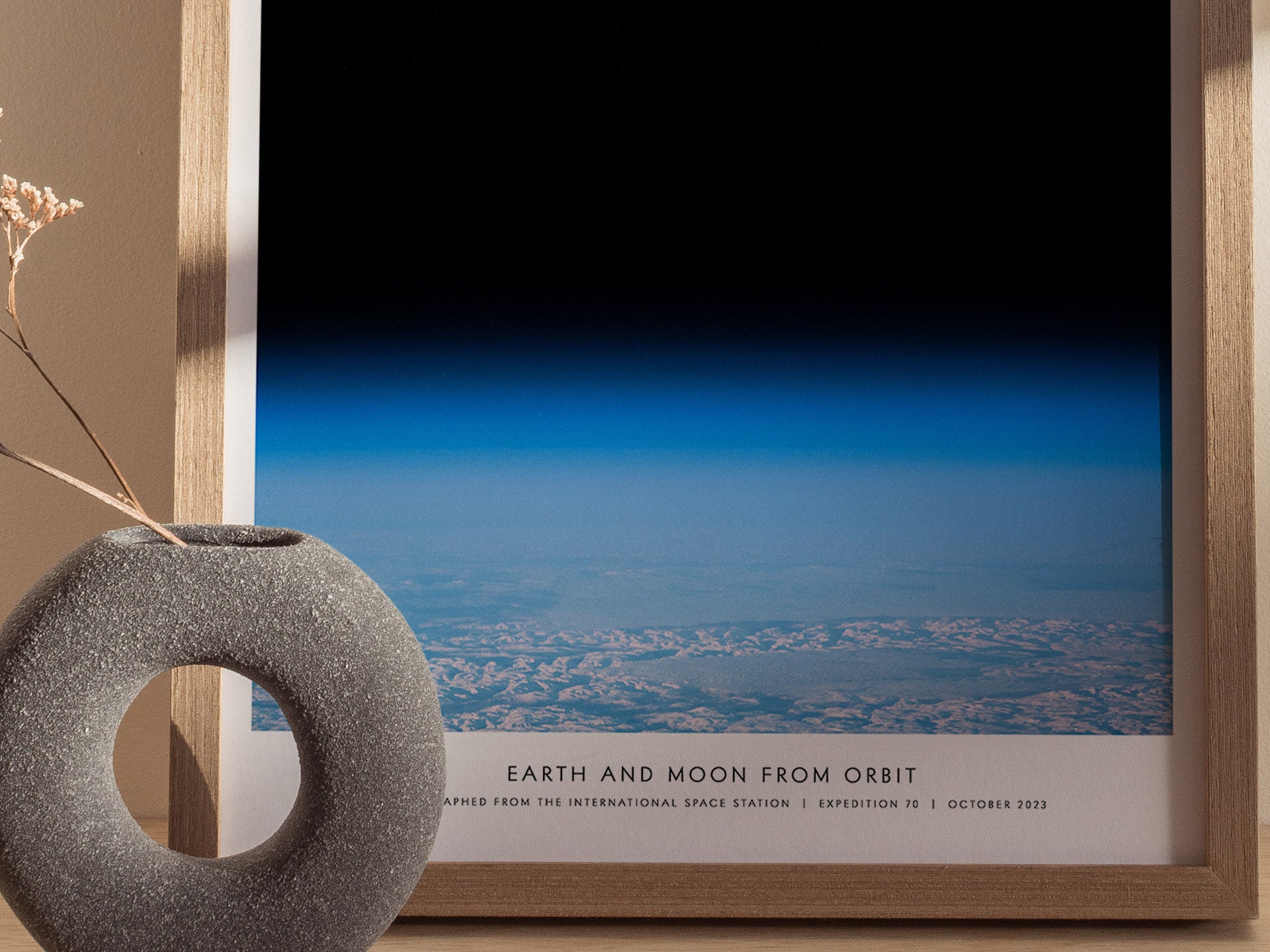 Close up of Earth and Moon Orbit poster featuring space view of Earth's curvature and the Moon above