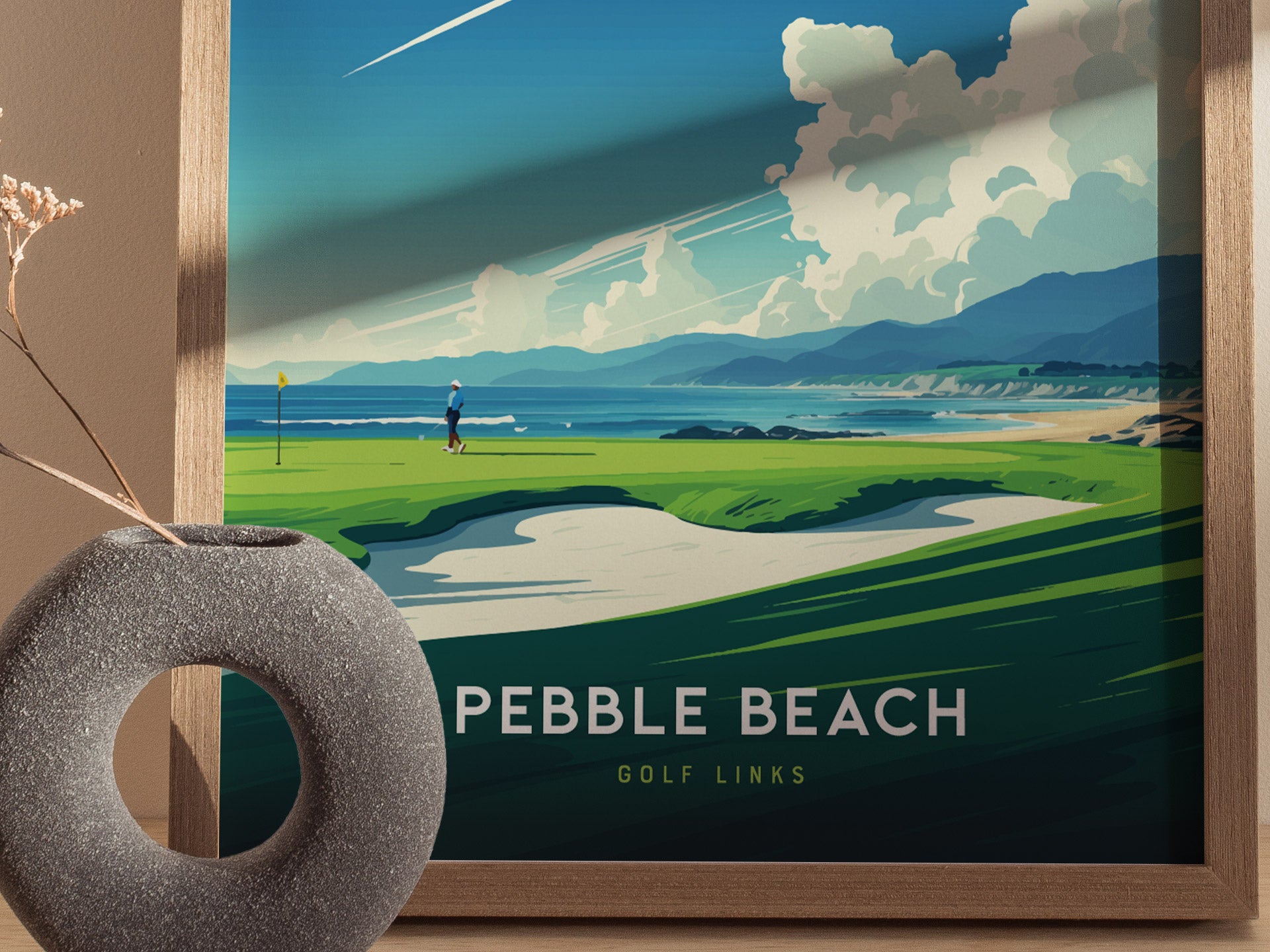 Framed poster of Pebble Beach Golf Links showcasing a golfer on a vibrant green course with dramatic coastal cliffs, ocean waves, and a clear blue sky.