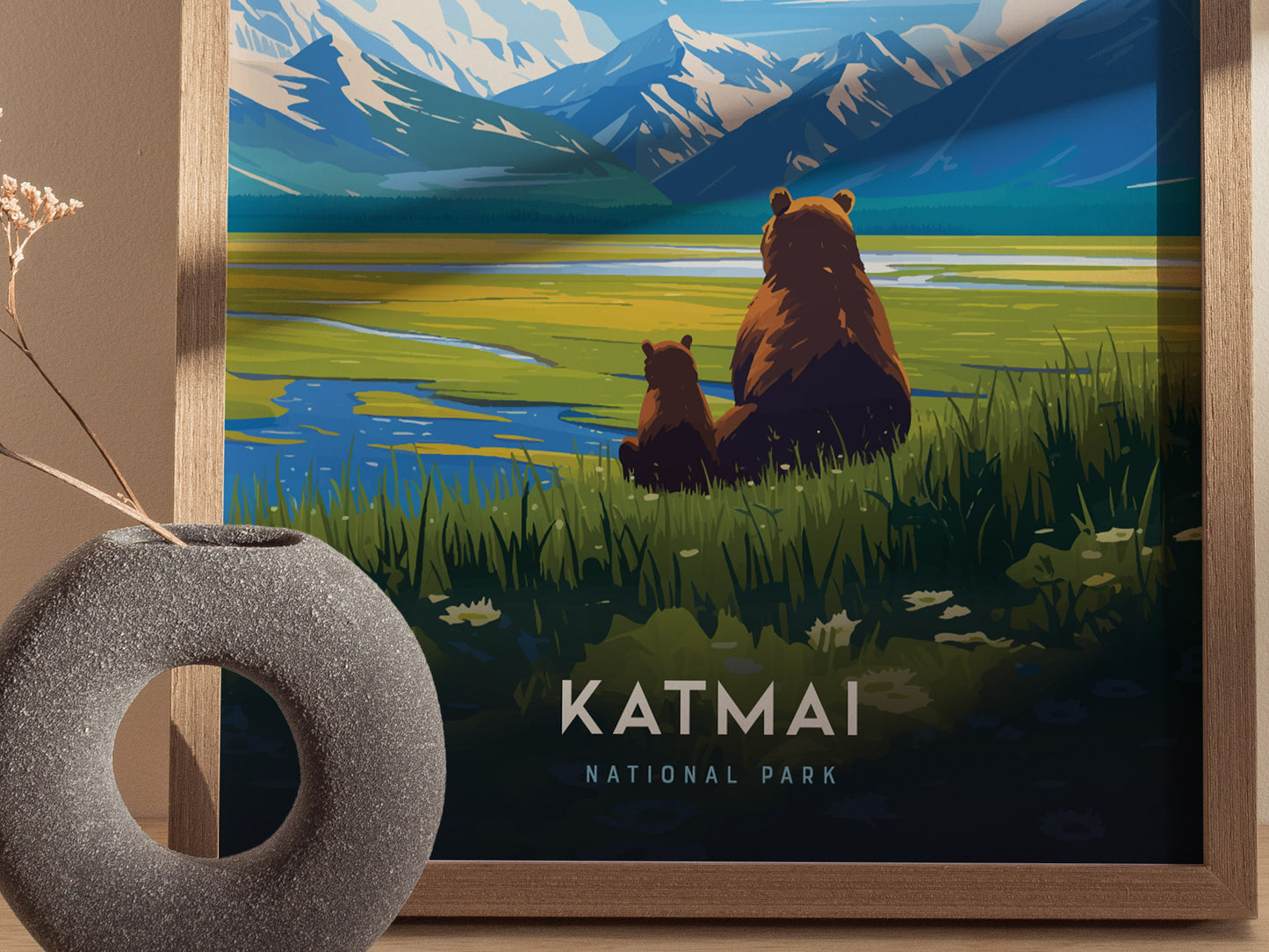 A framed poster depicts two brown bears sitting by a grassy lake, with snow-capped mountains in the background. The text Katmai National Park is visible at the bottom.