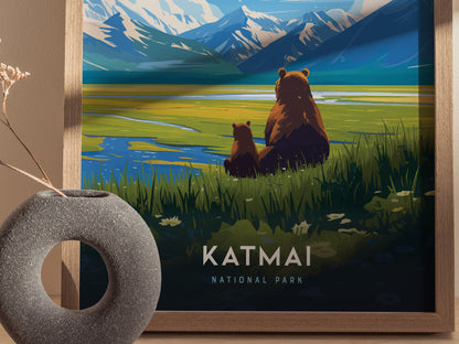 A framed poster depicts two brown bears sitting by a grassy lake, with snow-capped mountains in the background. The text Katmai National Park is visible at the bottom.