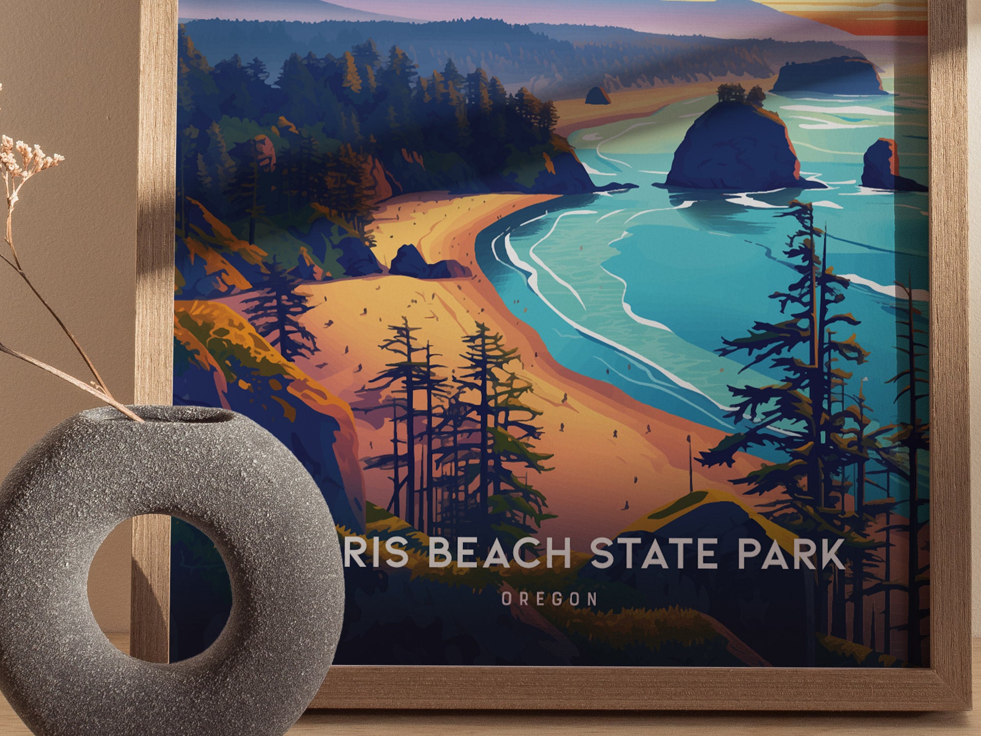 A framed poster of Harris Beach State Park featuring vibrant illustrations of coastal cliffs, sea stacks, and evergreen trees, with a decorative circular vase in the foreground.