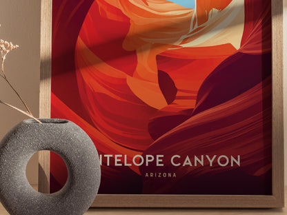 A framed Antelope Canyon poster with vibrant red and orange abstract designs is displayed next to a round, textured gray vase with dried flowers.