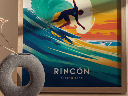A vibrant poster features a silhouette of a surfer riding a colorful wave with a sunset backdrop, framed in wood. A textured stone vase is visible in the foreground.
