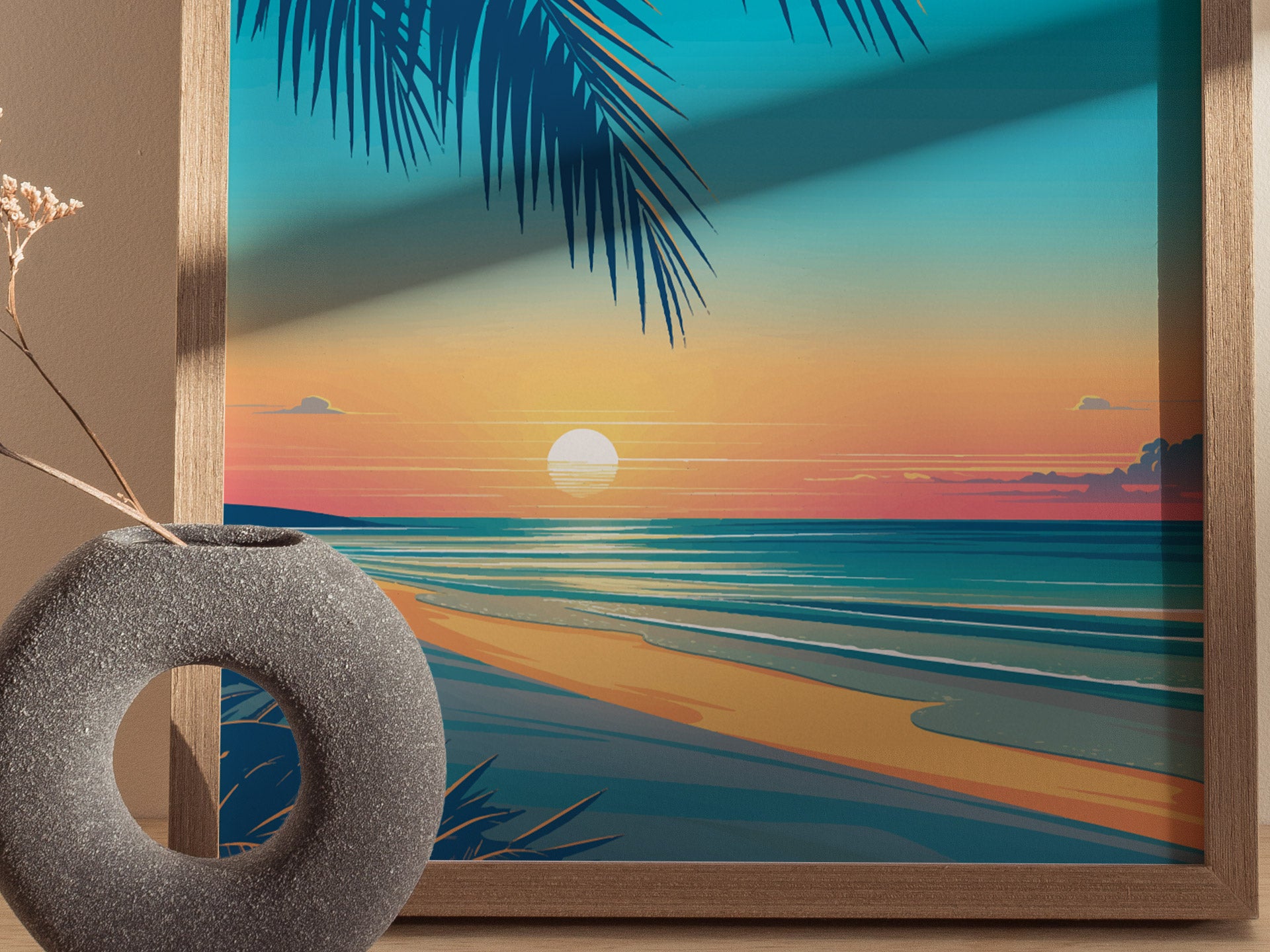 A framed artwork depicts a serene beach sunset with palm fronds, colorful sky, and calm ocean waves. A gray, circular vase with dried flowers is placed in the foreground.