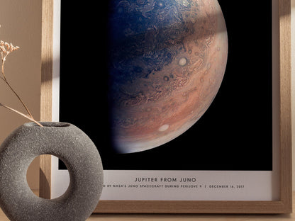 Close up of Jupiter from Juno poster showing colorful storm bands and atmospheric swirls