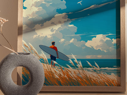 A framed artwork depicts a surfer with a board standing on a grassy dune, overlooking the ocean under a partly cloudy sky. A decorative vase is visible in the foreground.