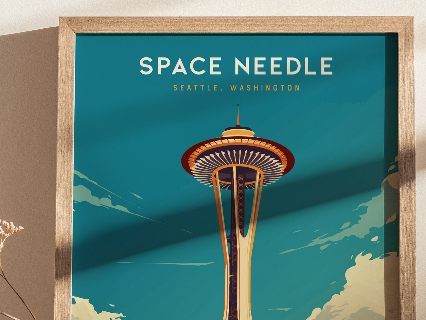 A framed poster depicting the Space Needle against a teal sky, with Space Needle Seattle, Washington text above. The artwork features a vintage travel style.
