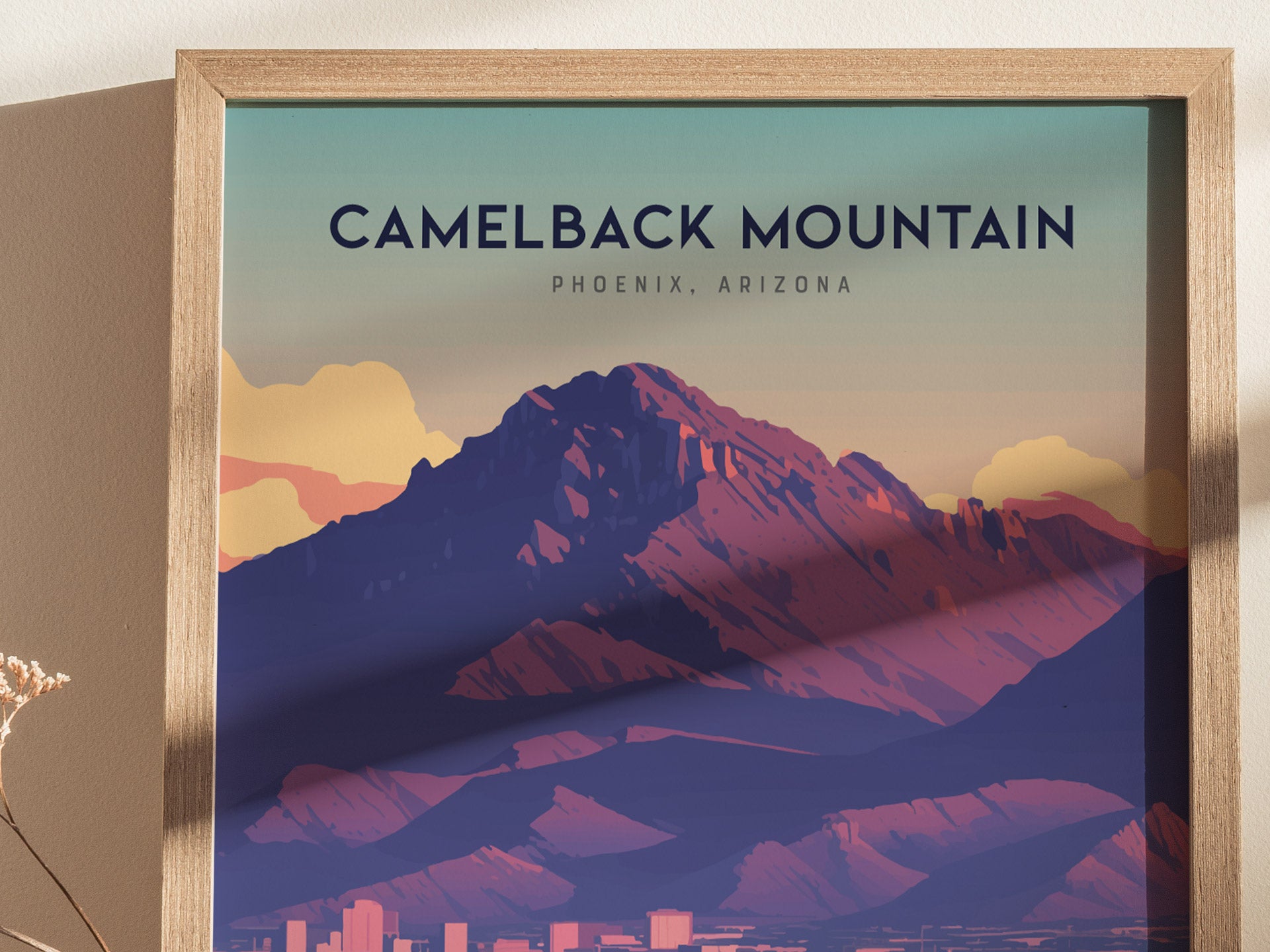 A framed poster of Camelback Mountain in Phoenix, Arizona, showcasing a stylized illustration with vibrant desert tones and dramatic silhouettes. Perfect for hiking and travel enthusiasts.