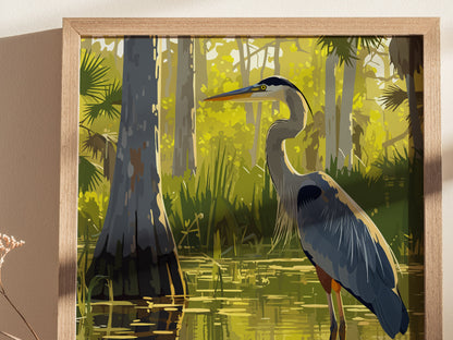 A framed art print depicts a Great Blue Heron standing in a lush, sunlit swamp with cypress trees and sawgrass. The serene scene highlights the vibrant colors of the Everglades.