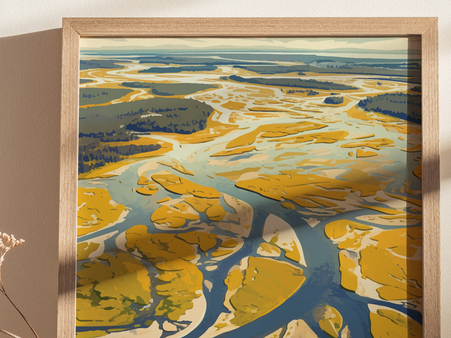 A framed poster depicting a stylized aerial view of a river winding through yellow and blue landscape, with abstract patterns and shadows.