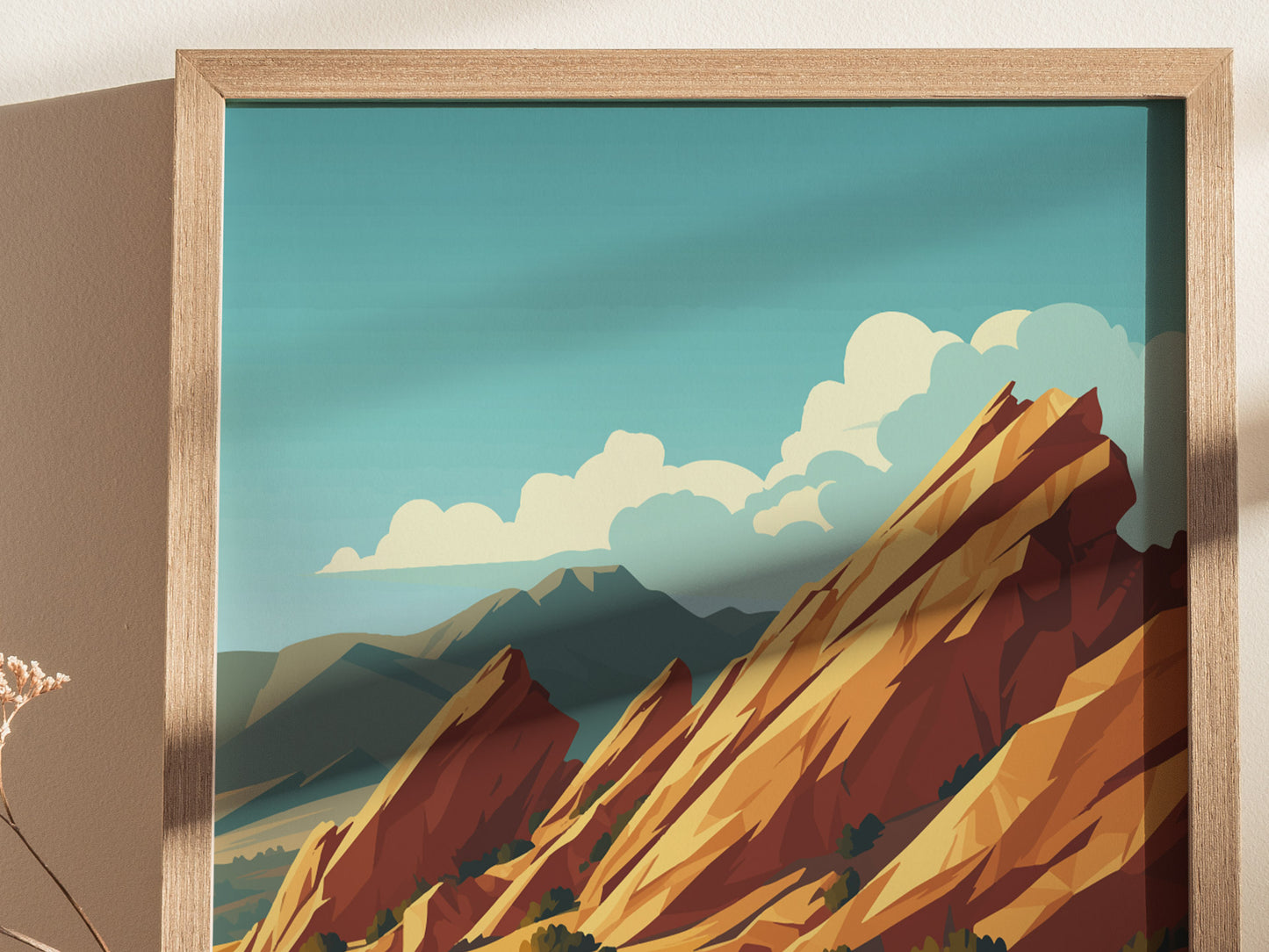 A framed poster depicting Vasquez Rocks with dramatic, tilted sandstone formations under a clear blue sky, accentuated by fluffy clouds. The artwork highlights the striking geological features.