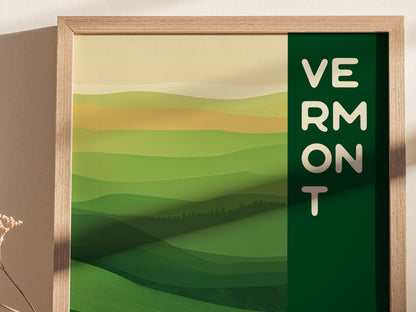 A framed poster featuring abstract green and yellow rolling hills with the word Vermont vertically aligned on the right, capturing a minimalist landscape design.