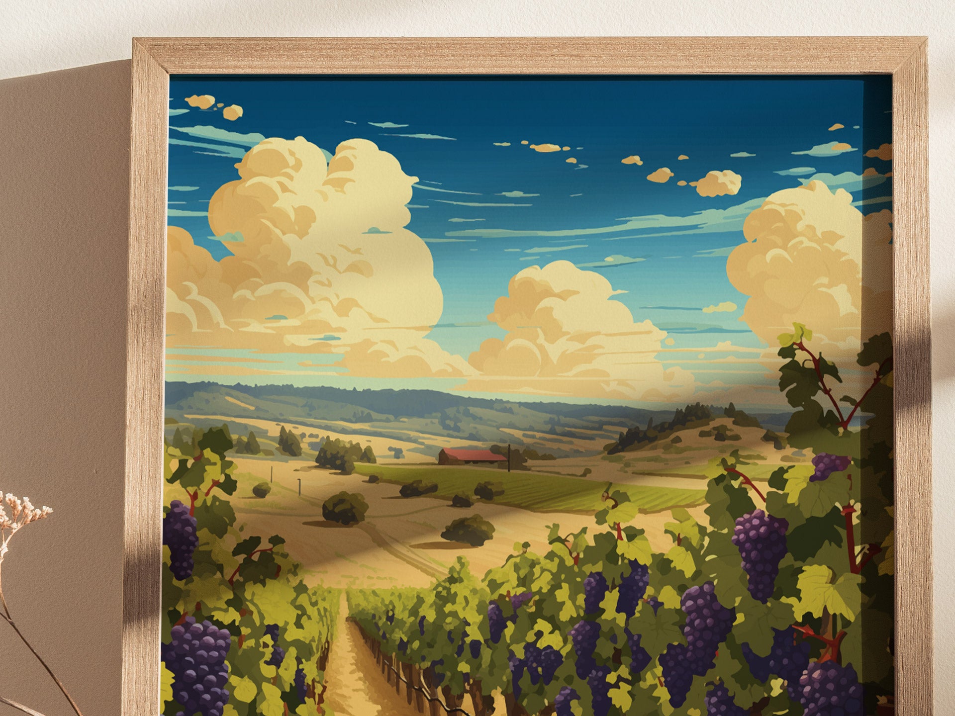 A framed poster depicts a scenic vineyard with grapevines in the foreground, rolling hills, and dramatic clouds against a blue sky, capturing the essence of wine country.