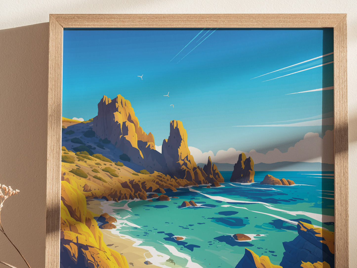 A framed artwork depicting a coastal landscape with towering rock formations, turquoise waters, and seagulls in a clear blue sky. The scene is sunlit, highlighting the natural beauty.
