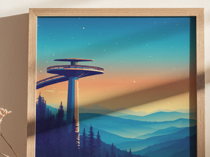 The image features a framed poster of Clingmans Dome, showcasing the observation tower against a vibrant sunset sky. Below are silhouettes of trees and layered mountain ridges, creating a serene and picturesque scene.