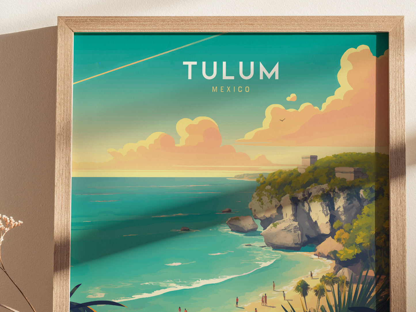 Framed artwork depicting Tulum, Mexico, features vibrant turquoise waters and Mayan ruins on a cliff. The scene includes fluffy clouds and a sandy beach with small figures.