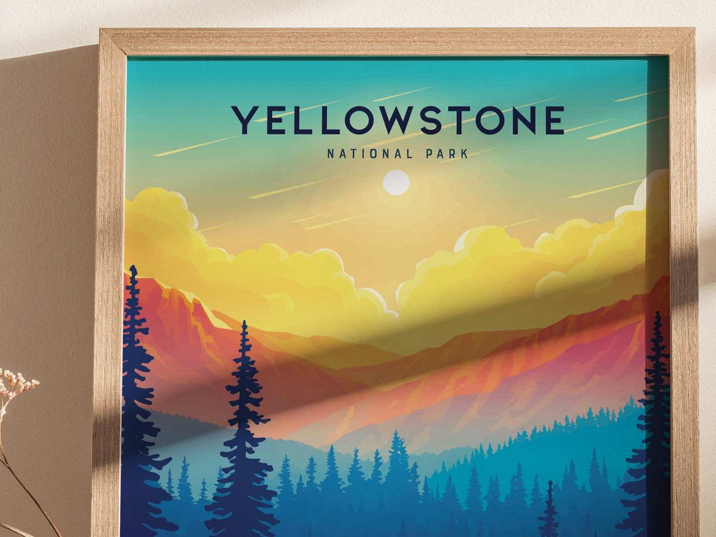 Framed poster depicting a vibrant sunset over Yellowstone National Park, featuring colorful mountain silhouettes and tall pine trees under a clear sky.