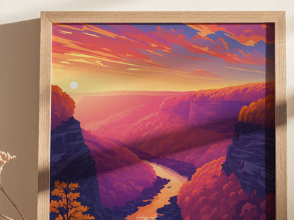 A framed poster depicting a vibrant sunset over a gorge, with a winding river and colorful, forested canyon walls in shades of pink, orange, and purple.