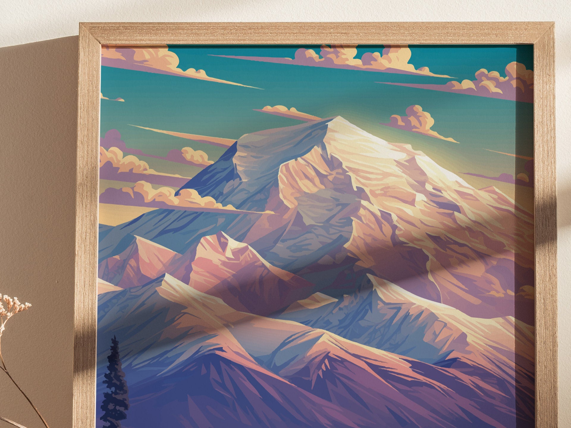 A framed poster featuring a colorful illustration of a majestic mountain landscape, with vibrant skies and dramatic peaks. The artwork is set against a simple wall background.