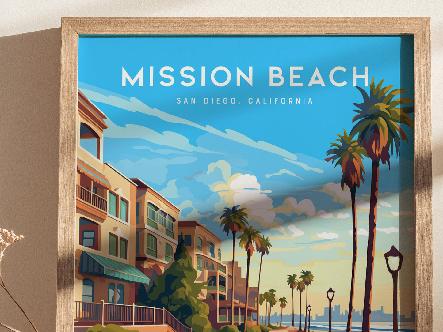 A framed poster of Mission Beach, San Diego, featuring a vibrant coastal scene with palm trees, colorful buildings,.