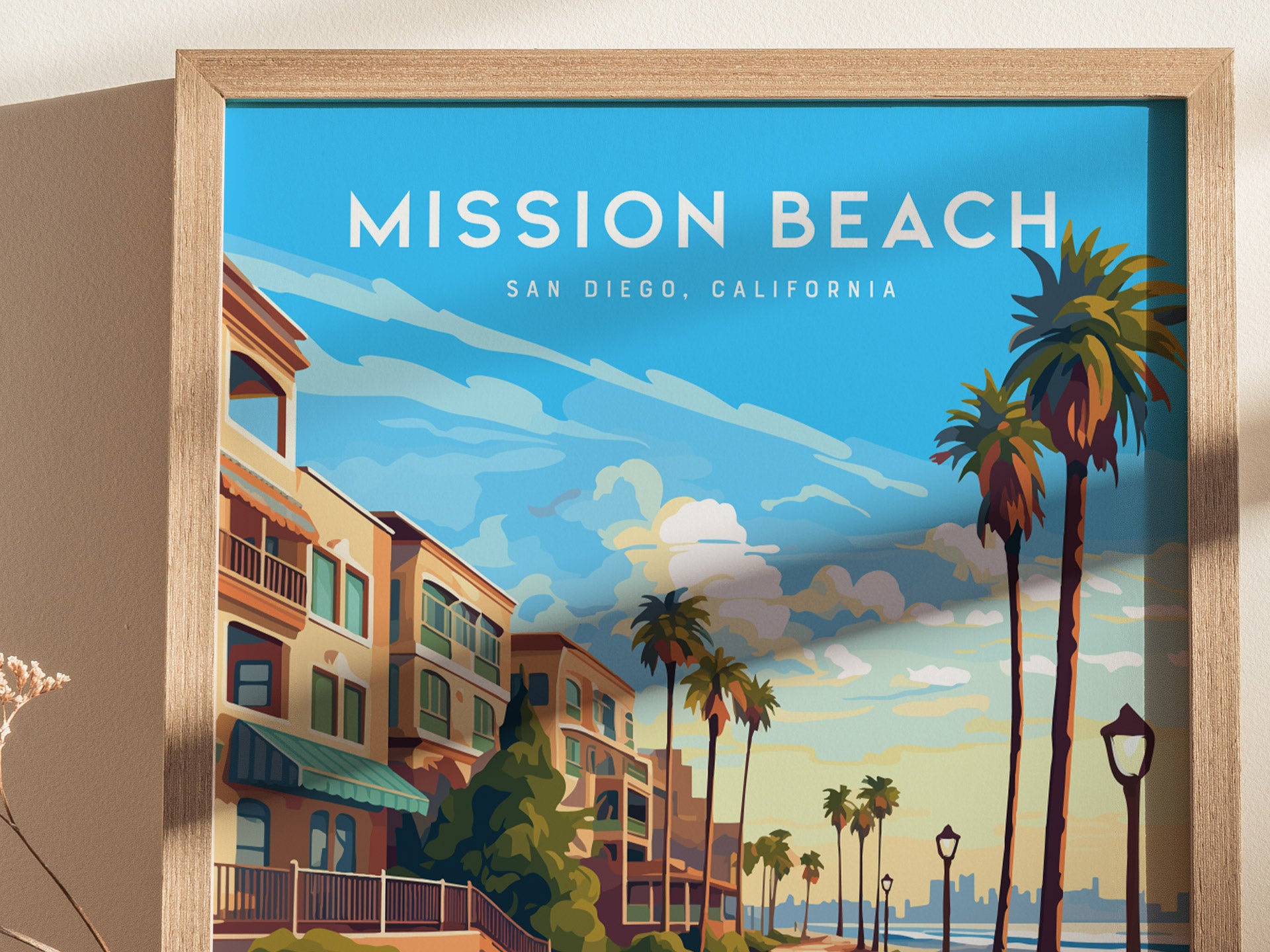A framed poster of Mission Beach, San Diego, featuring a vibrant coastal scene with palm trees, colorful buildings,.
