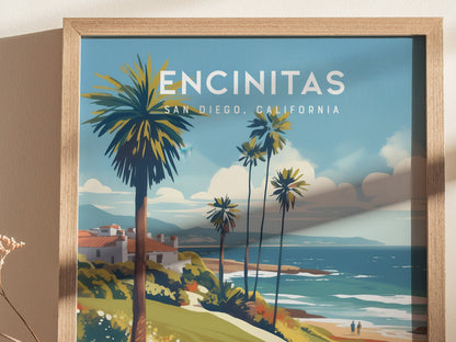 Framed artwork of Encinitas, California features a coastal scene with palm trees, ocean waves, and distant hills under a blue sky. The vibrant illustration captures a serene beach atmosphere.