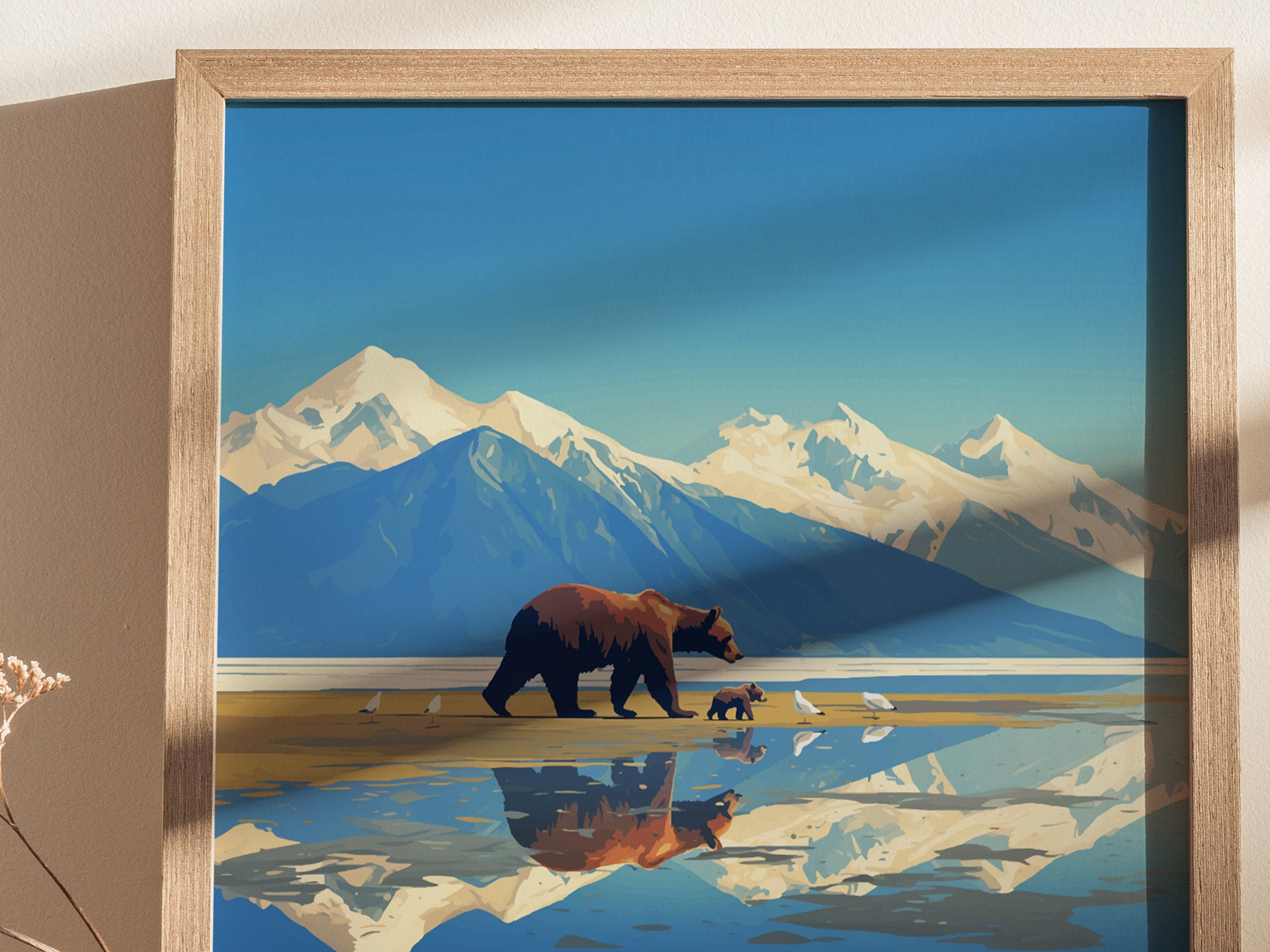 Illustration of a bear and cub walking along a reflective lake, with snow-capped mountains in the background, framed in light wood. The scene captures a serene wilderness setting.