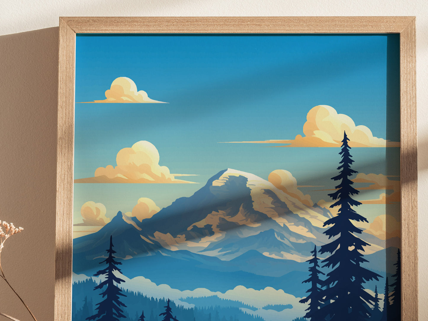 A framed poster depicts a stylized Mount Rainier with a glaciated summit and surrounding evergreen trees under a vibrant blue sky with fluffy clouds.