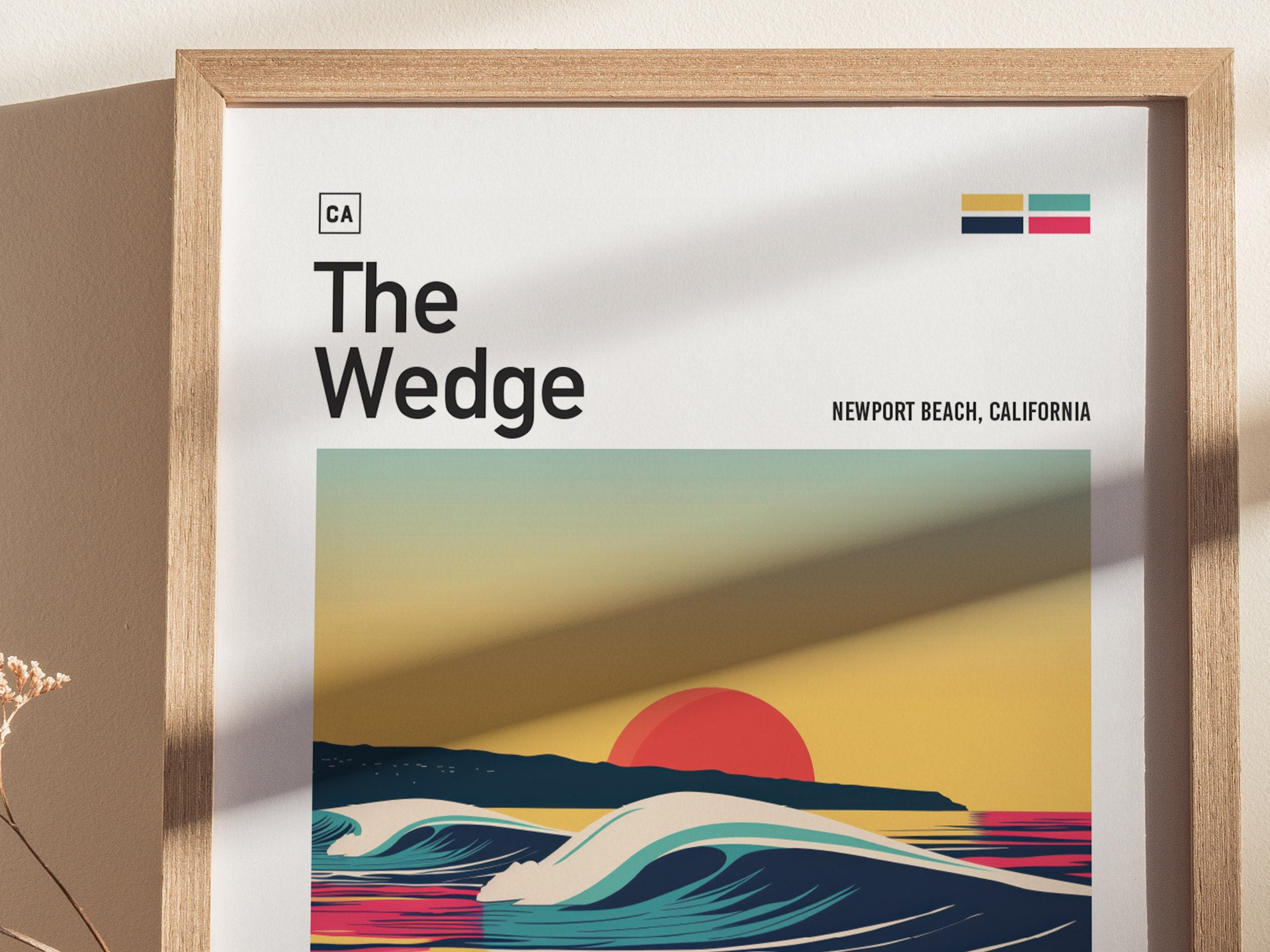 Framed poster titled The Wedge depicts a stylized wave with a vibrant sunset background, featuring bold colors and minimalist design, labeled Newport Beach, California.