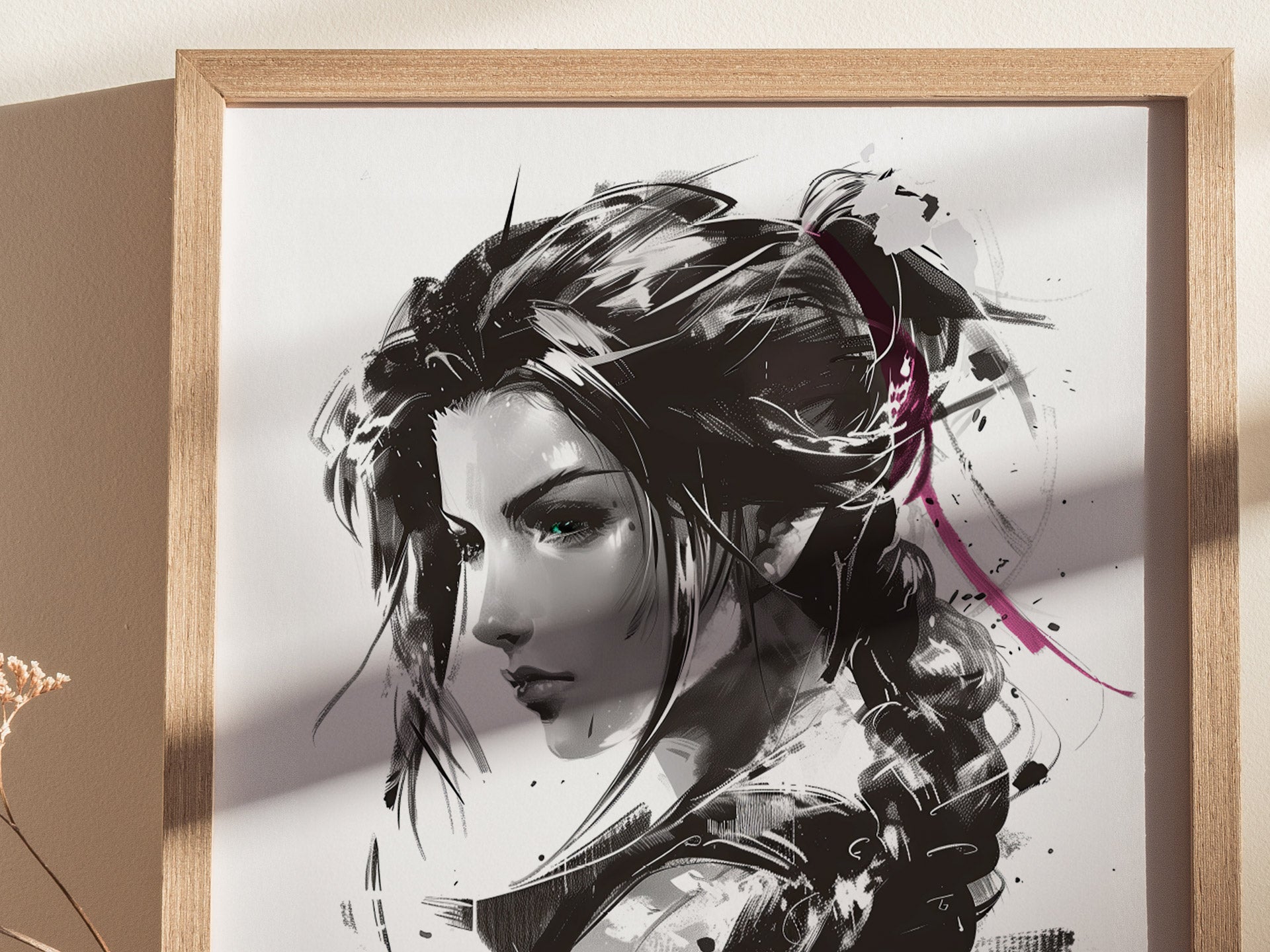 Monochrome portrait of a woman with long hair, accented by pink highlights, framed in light wood, displayed against a neutral wall with soft shadows.