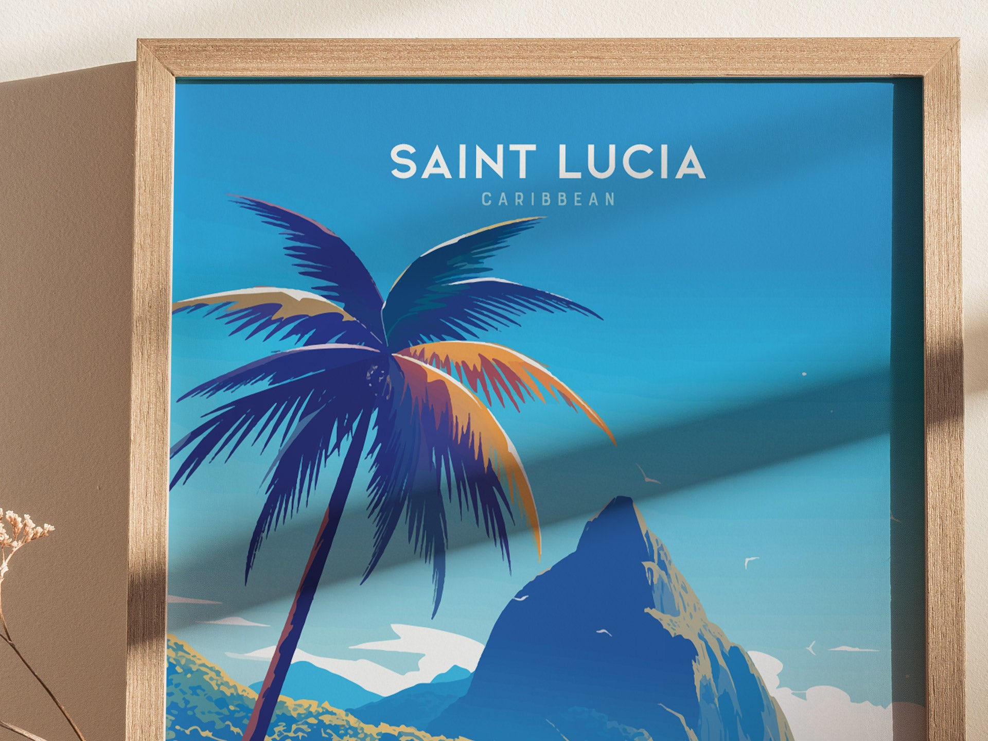 A framed poster of Saint Lucia, featuring a stylized palm tree and the iconic Pitons against a vibrant blue sky, with text reading SAINT LUCIA CARIBBEAN.