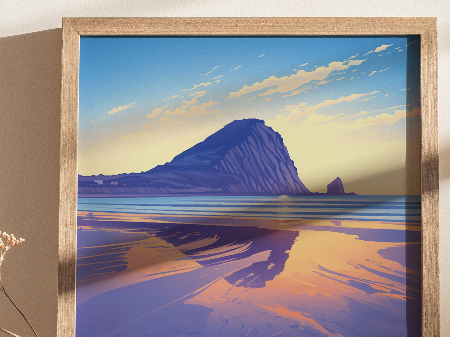 A framed poster depicting Morro Rock at sunset, with vibrant reflections on the water and a dramatic sky. The artwork features bold colors and a serene coastal landscape.