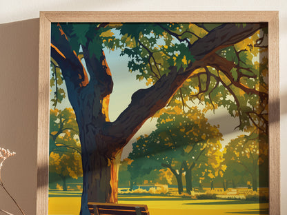 Framed artwork depicting a sunlit park scene with a large tree, vibrant green and yellow foliage, and a wooden bench. The print is set against a neutral wall background.