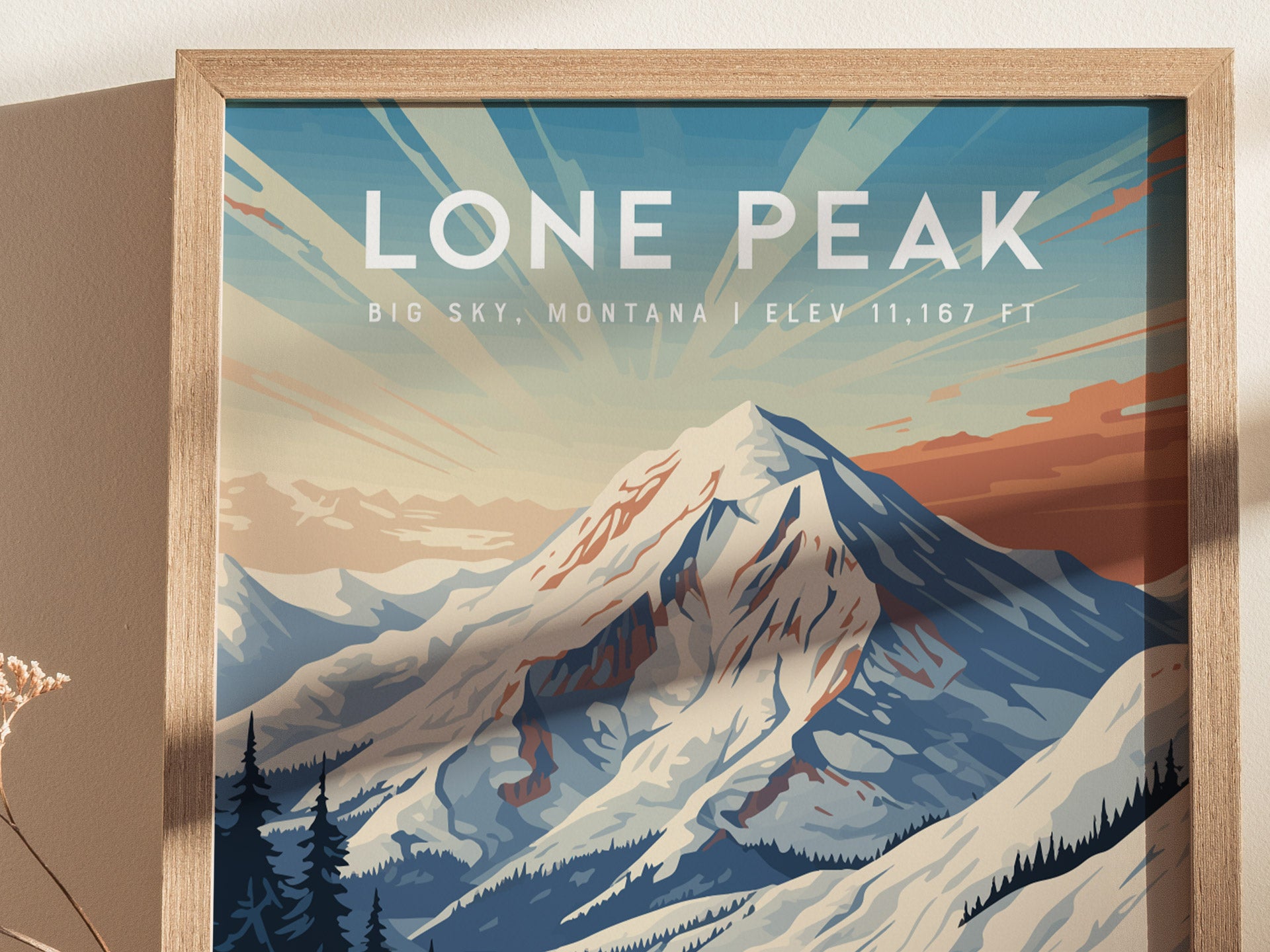 Framed artwork depicting Lone Peak in Big Sky, Montana, with stylized snow-capped mountains and a colorful sky. Text reads Lone Peak, Big Sky, Montana, Elev 11,167 ft.