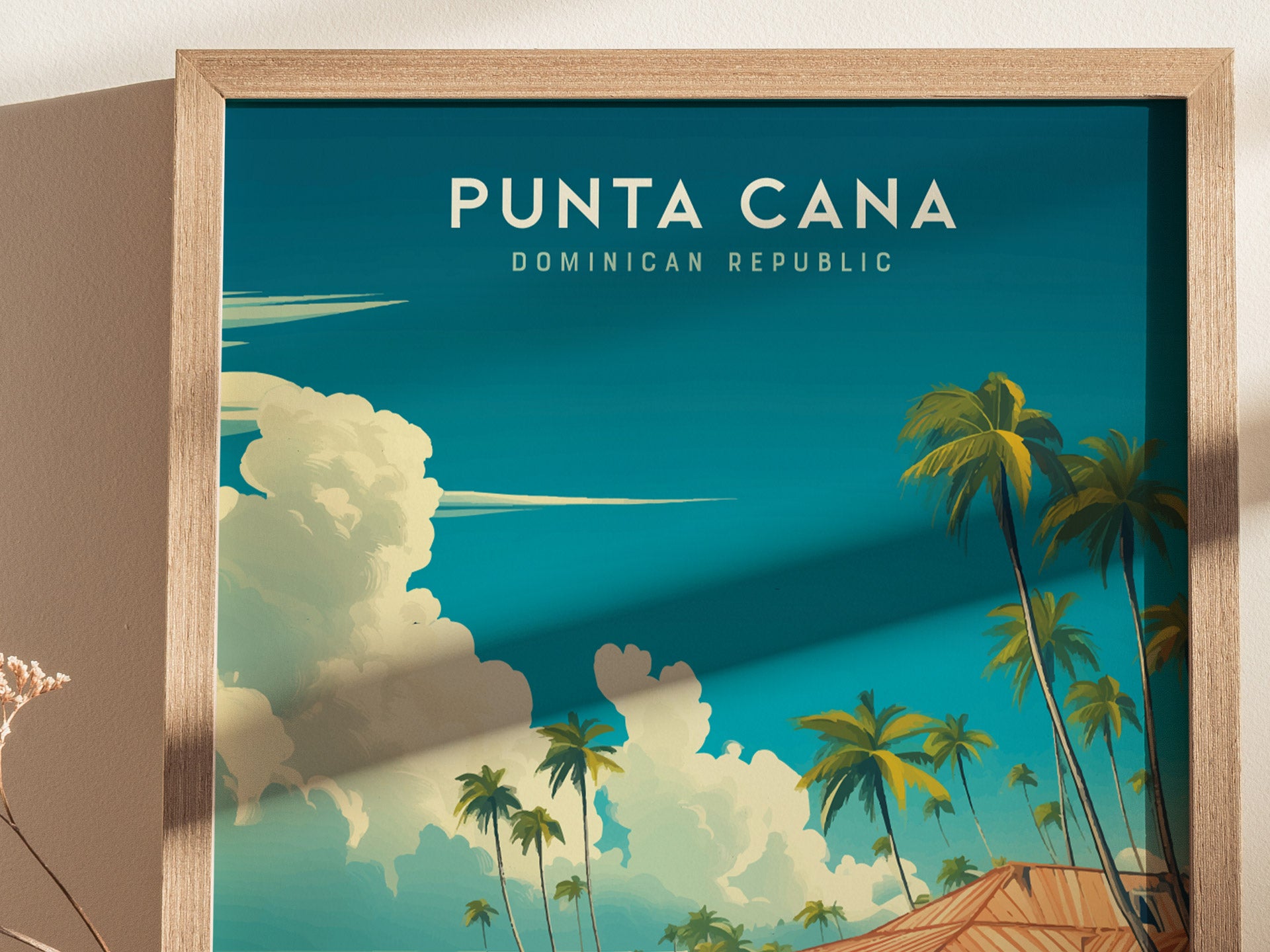 A framed poster featuring a vibrant illustration of Punta Cana, Dominican Republic, with a deep blue sky, fluffy clouds, and tall palm trees swaying over a wooden beach hut. The text PUNTA CANA is prominently displayed at the top.