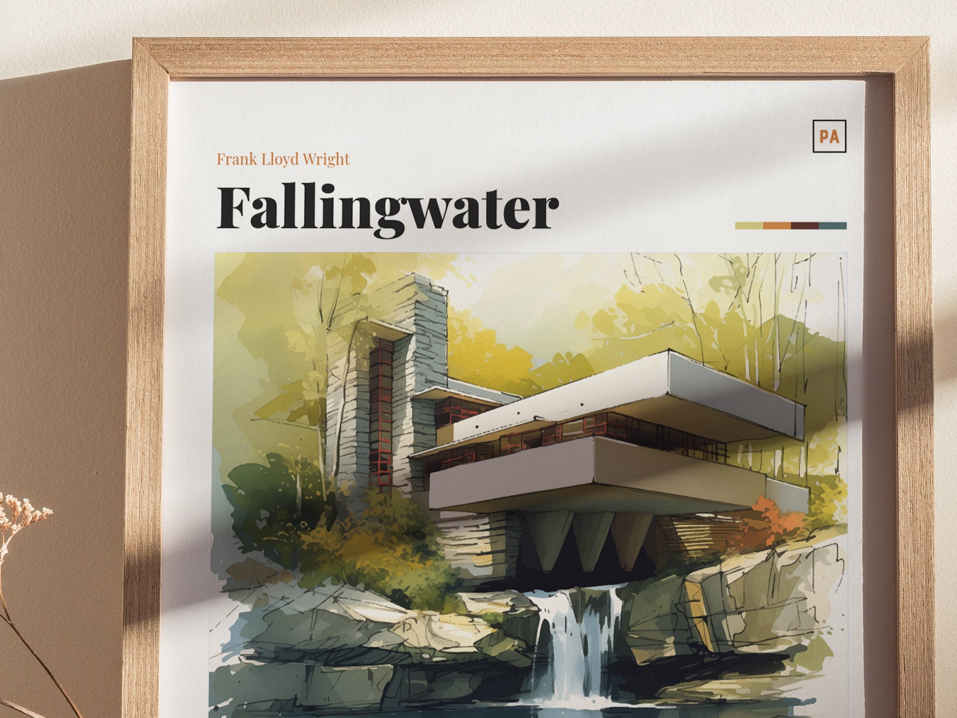A framed poster features a watercolor illustration of Frank Lloyd Wrights Fallingwater, highlighting its modern architecture and natural surroundings. The image includes the text Fallingwater at the top.