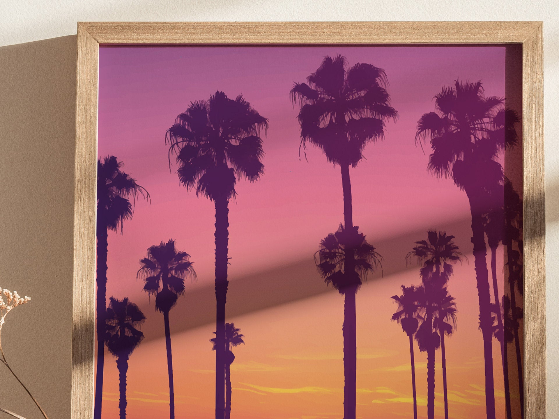 Framed poster featuring silhouetted palm trees against a vibrant sunset with hues of purple, pink, and orange. The artwork captures a serene and picturesque evening scene.