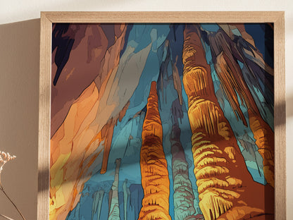 Framed art print depicting vibrant orange and blue stalagmites and stalactites in a cave setting, with intricate rock formations. A shadow is cast on the wall beside it.