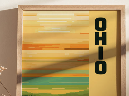 A framed poster with horizontal, minimalist stripes in warm yellow and orange hues features the word OHIO vertically on the right. Soft shadows add depth to the composition.
