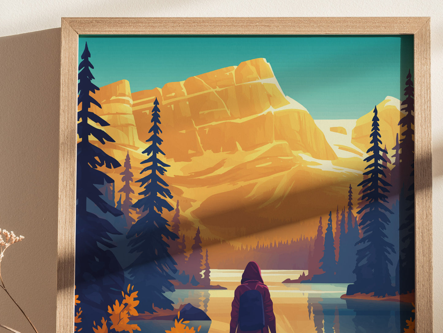 A framed poster depicts a stylized landscape with a person in a hooded jacket facing a tranquil lake, surrounded by tall evergreens and majestic golden mountains under a clear sky.