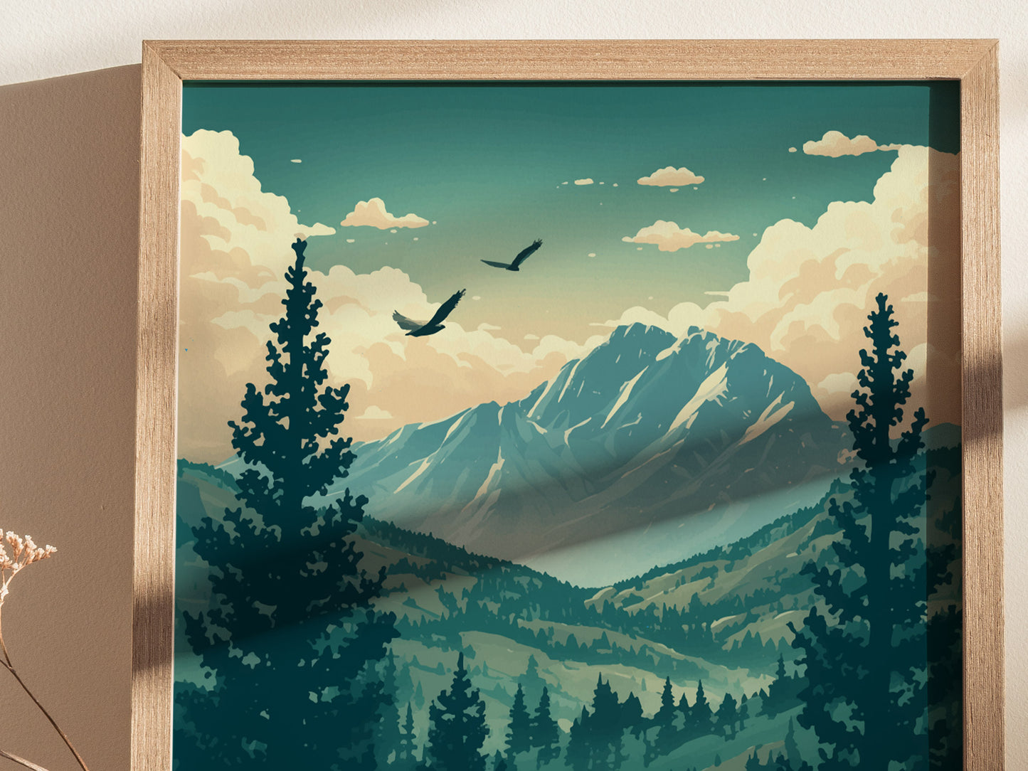 Illustrated poster of a mountain landscape with tall evergreen trees, soaring birds, and a majestic peak under a blue sky with fluffy clouds. Framed in light wood.