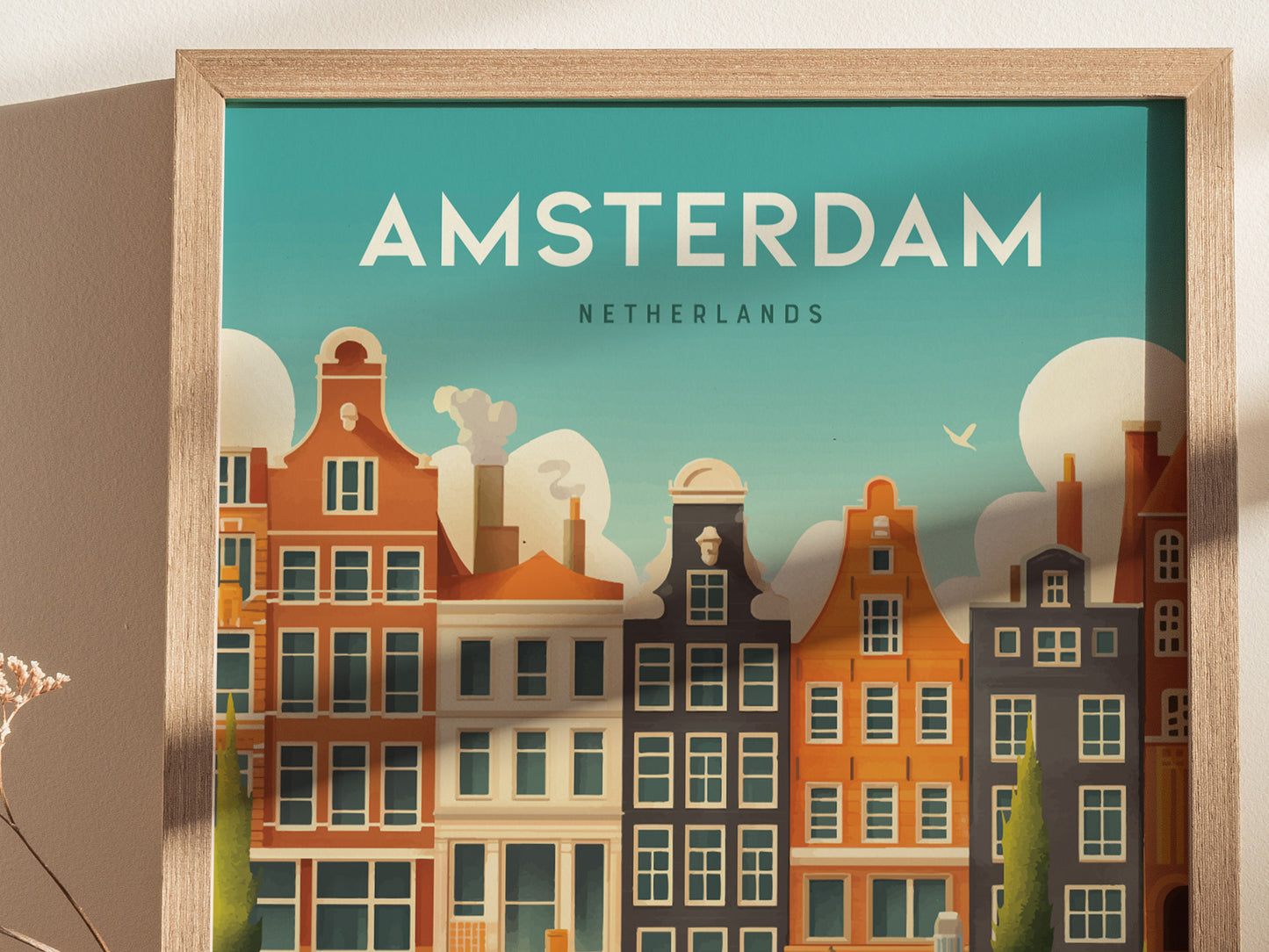 A framed art print features stylized buildings and architecture of Amsterdam under a bright sky, with AMSTERDAM NETHERLANDS text above. The scene reflects classic Dutch design elements.