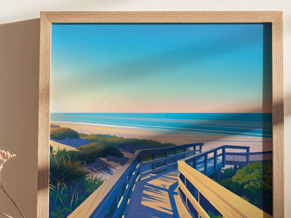 A framed artwork depicting a scenic coastal view with a wooden boardwalk leading to the beach, surrounded by lush greenery and a calm ocean under a vibrant blue sky.