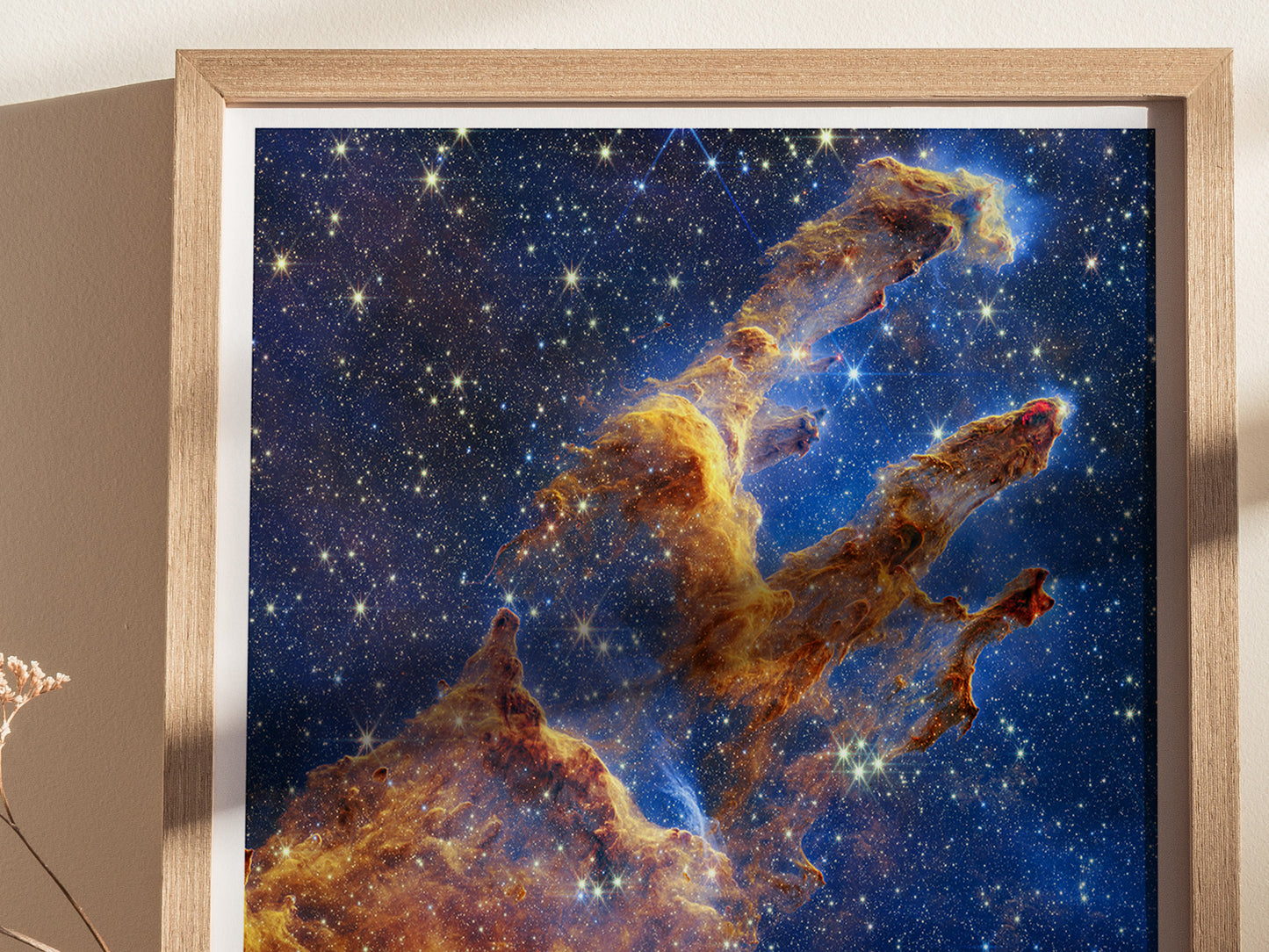 Close-up view of the framed Pillars of Creation JWST poster