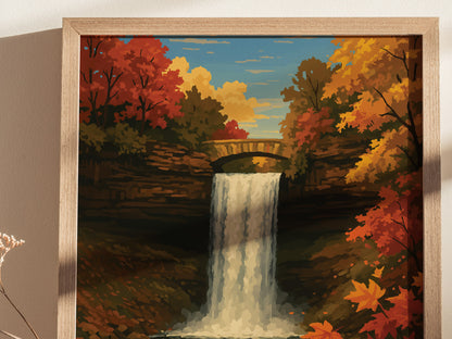 A framed poster depicts a scenic waterfall cascading over a stone ledge, surrounded by vibrant autumn foliage and a stone bridge under a partly cloudy sky.