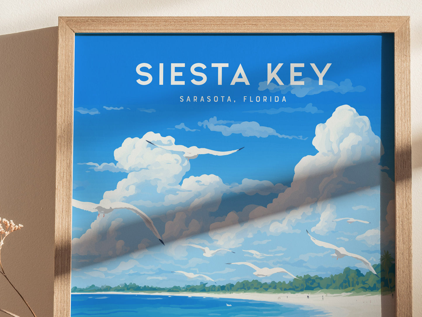 Framed poster of Siesta Key, Sarasota, Florida, featuring a vibrant blue sky with fluffy clouds, seagulls soaring, and a distant view of a lush green shoreline.