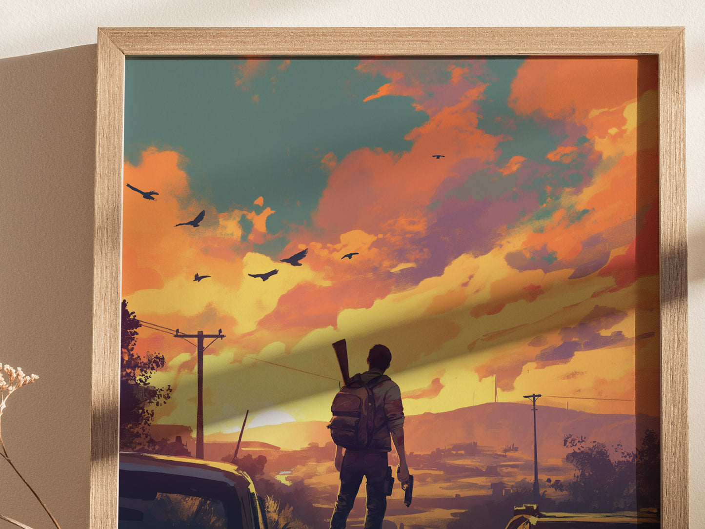 A lone figure stands with a rifle on their back, facing a vibrant sunset sky with scattered birds. The scene is framed in a light wooden frame.