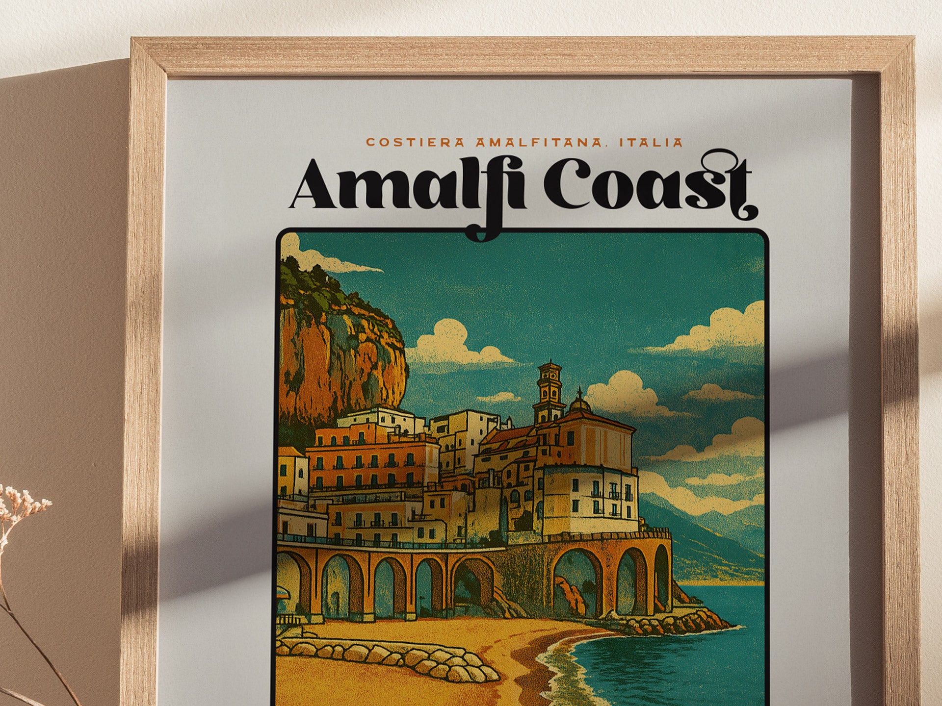 Framed poster of Amalfi Coast with a scenic illustration of coastal buildings.