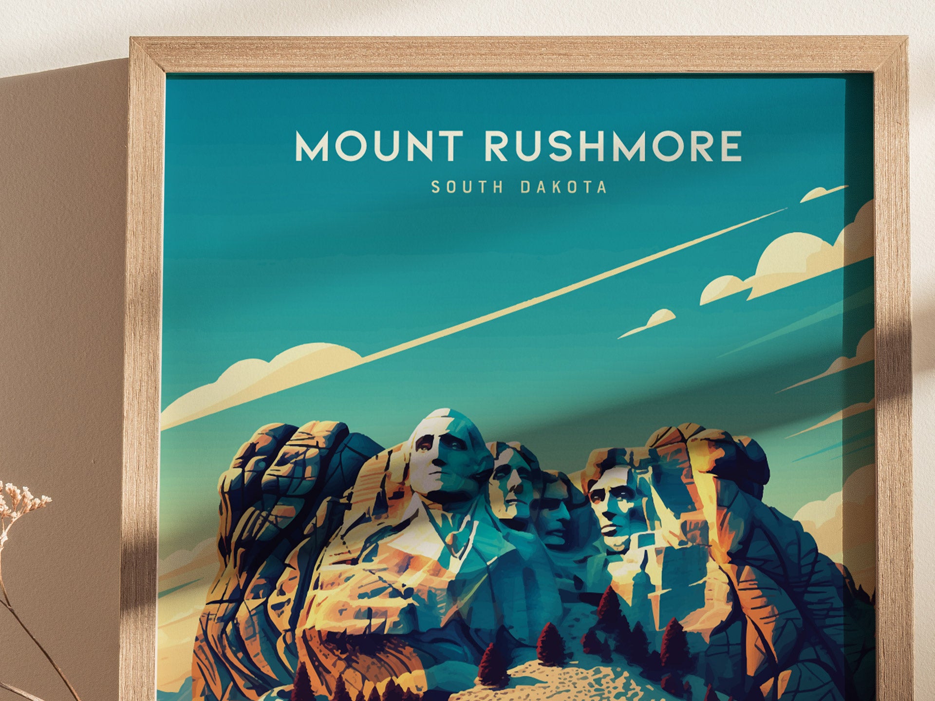A framed Mount Rushmore poster features a stylized illustration of the iconic monument under a blue sky with clouds, emphasizing the granite carvings and surrounding landscape.